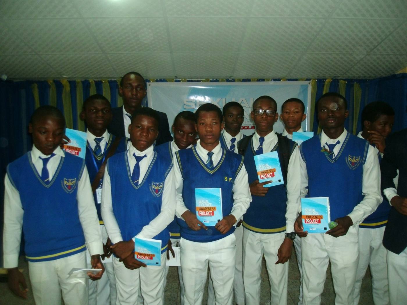 Students at St Finbarr’s College holding the Understanding Basic Human Rights handbook