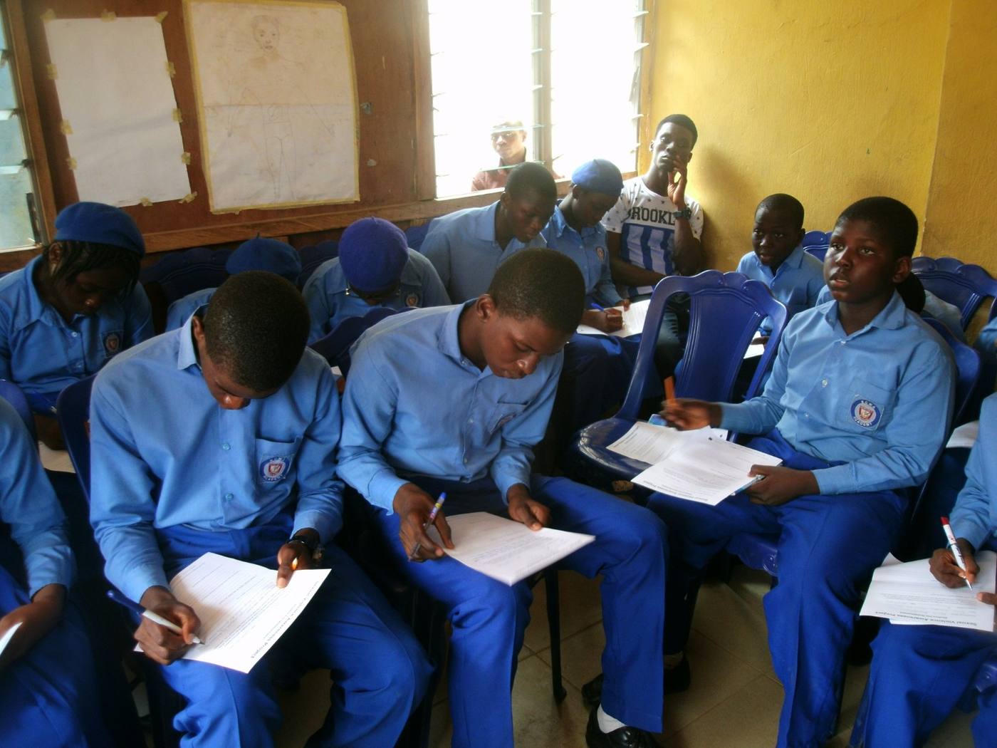 Students working through the session material in a classroom